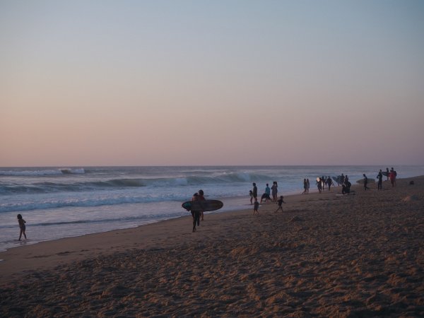 Surfen mit Sonnenuntergang
